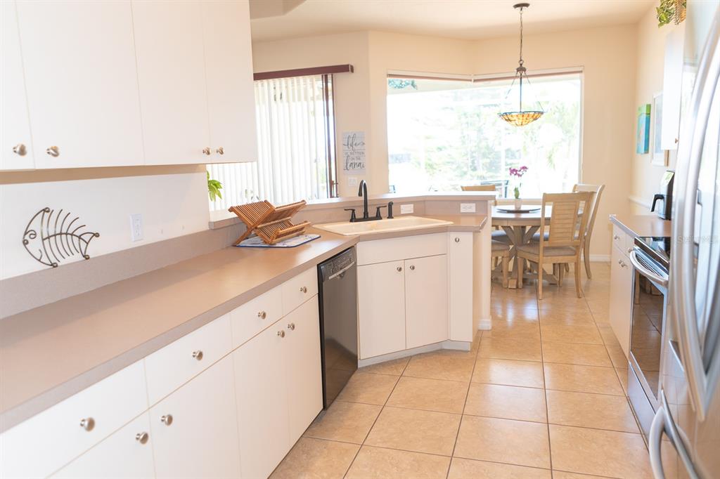 14 Windward Terrace Placida, FL 33946 - Photo 14 of 41 a kitchen with a sink a counter top space and cabinets
