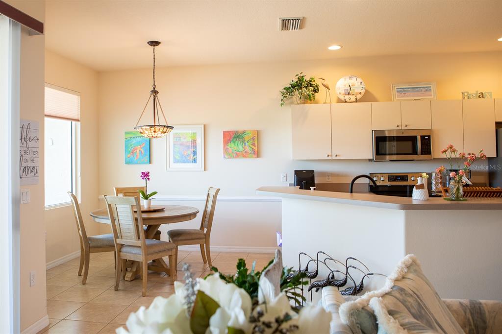14 Windward Terrace Placida, FL 33946 - Photo 15 of 41 a view of a dining room with furniture and a chandelier