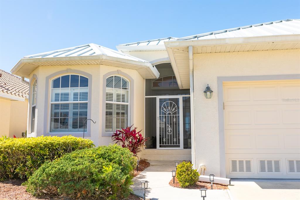 14 Windward Terrace Placida, FL 33946 - Photo 2 of 41 a front view of a house with a garden