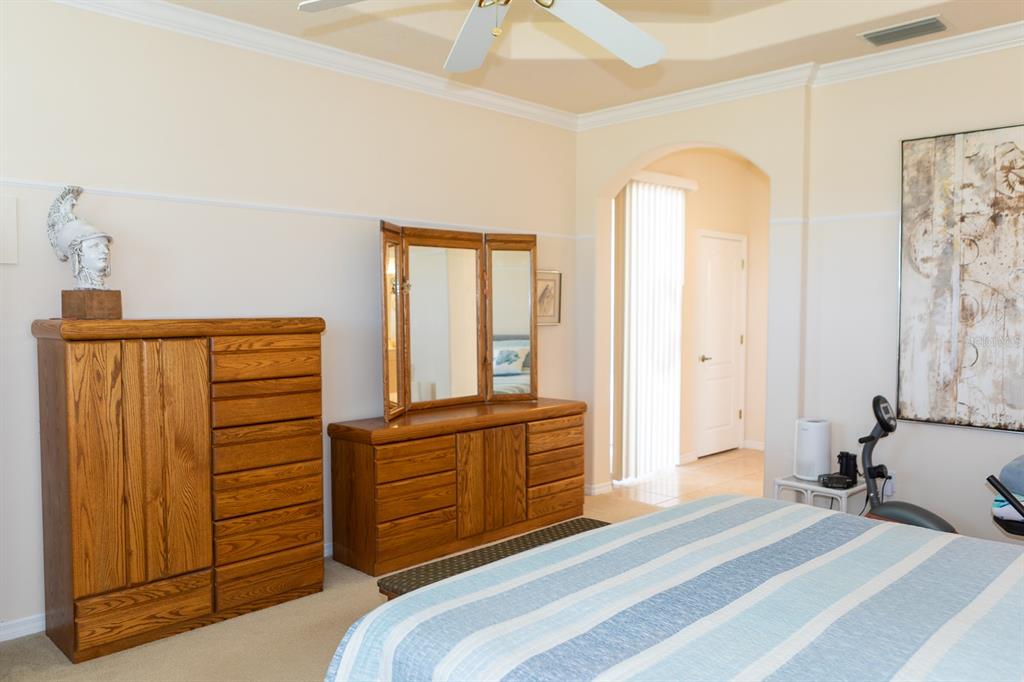 14 Windward Terrace Placida, FL 33946 - Photo 21 of 41 a bedroom with a bed and a dresser