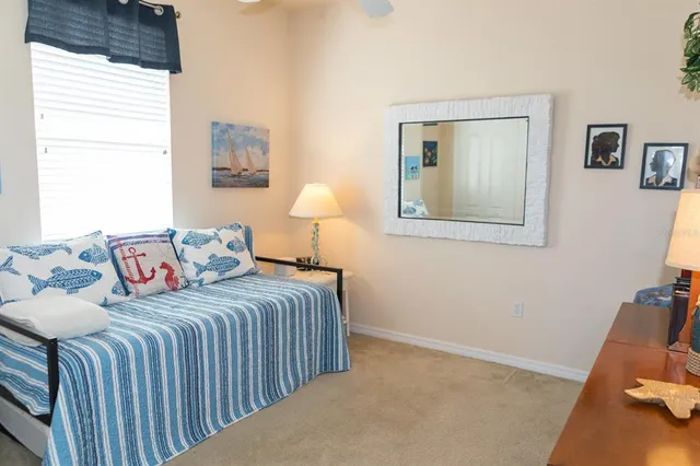 a bedroom with a bed and a couch