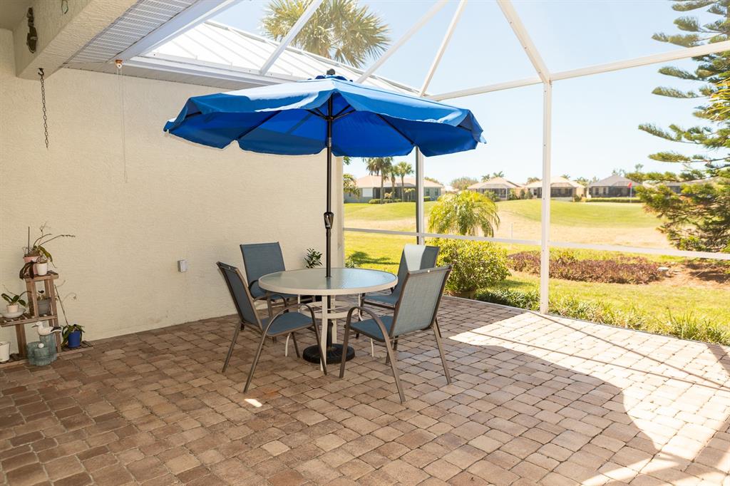 14 Windward Terrace Placida, FL 33946 - Photo 37 of 41 a view of a patio with table and chairs under an umbrella