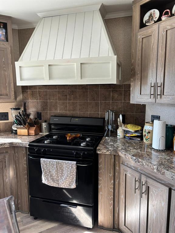 7067 South State Highway 78 Bonham, TX 75418 - Photo 11 of 40 a stove top oven sitting inside of a kitchen