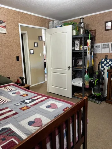 a kitchen that has a refrigerator and a stove in it