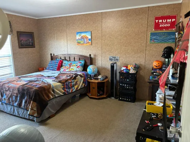 a bedroom with a bed and furniture