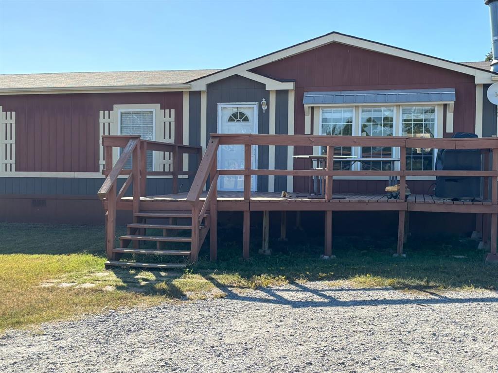 7067 South State Highway 78 Bonham, TX 75418 - Photo 2 of 40 a front view of a house with a yard