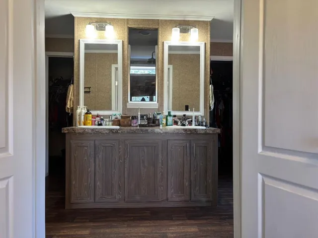 a bathroom with a sink and a mirror