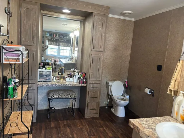 a room with wooden floor and furniture