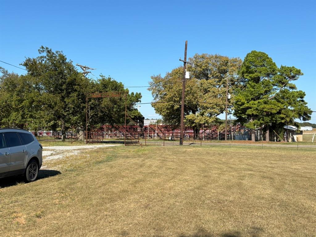 7067 South State Highway 78 Bonham, TX 75418 - Photo 37 of 40 a view of a parking space with a large trees