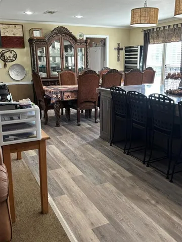a living room with lots of furniture and a clock