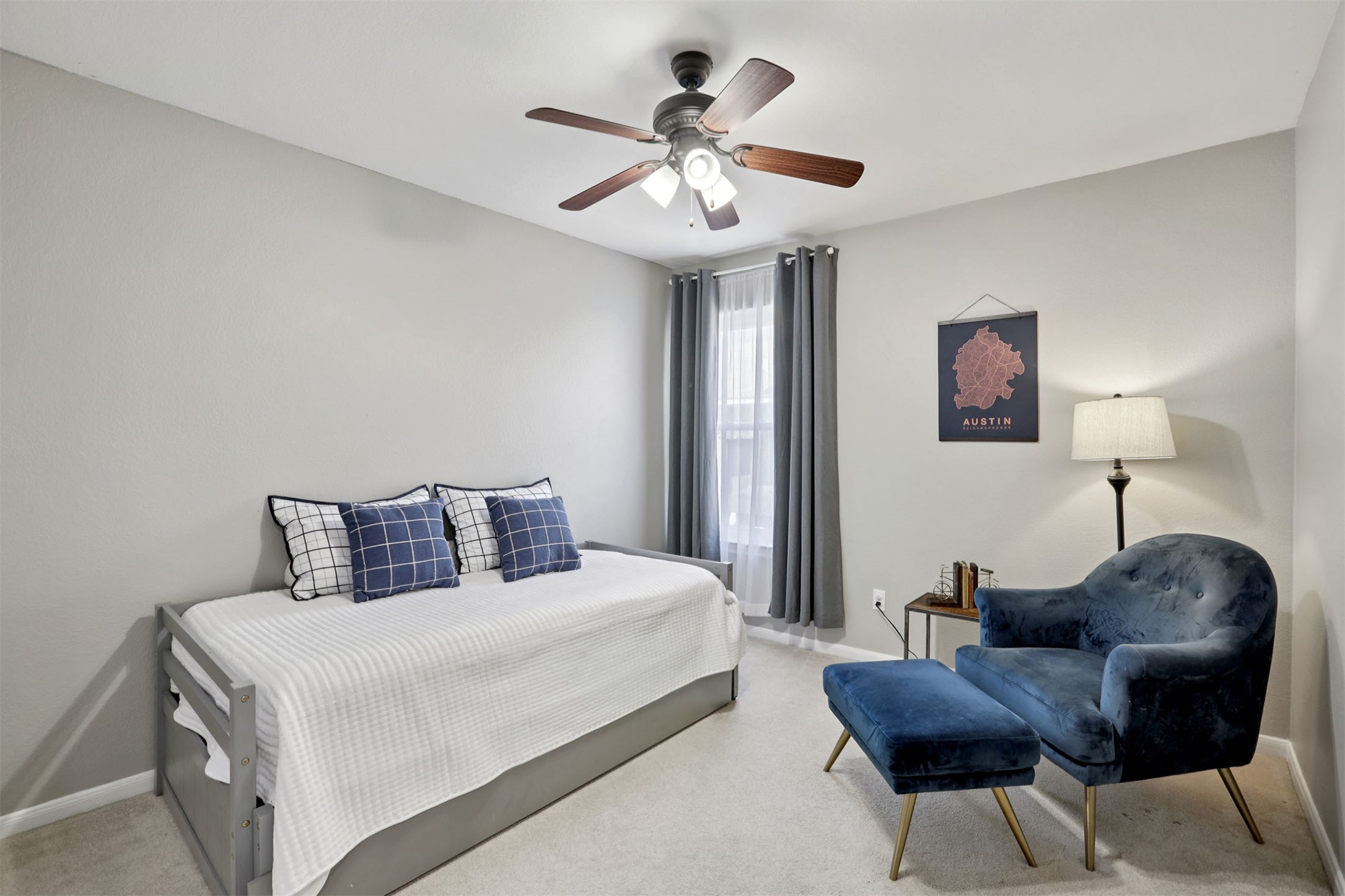 902 Ridgemont Circle Leander, TX 78641 - Photo 16 of 34 a bedroom with a bed and a chandelier