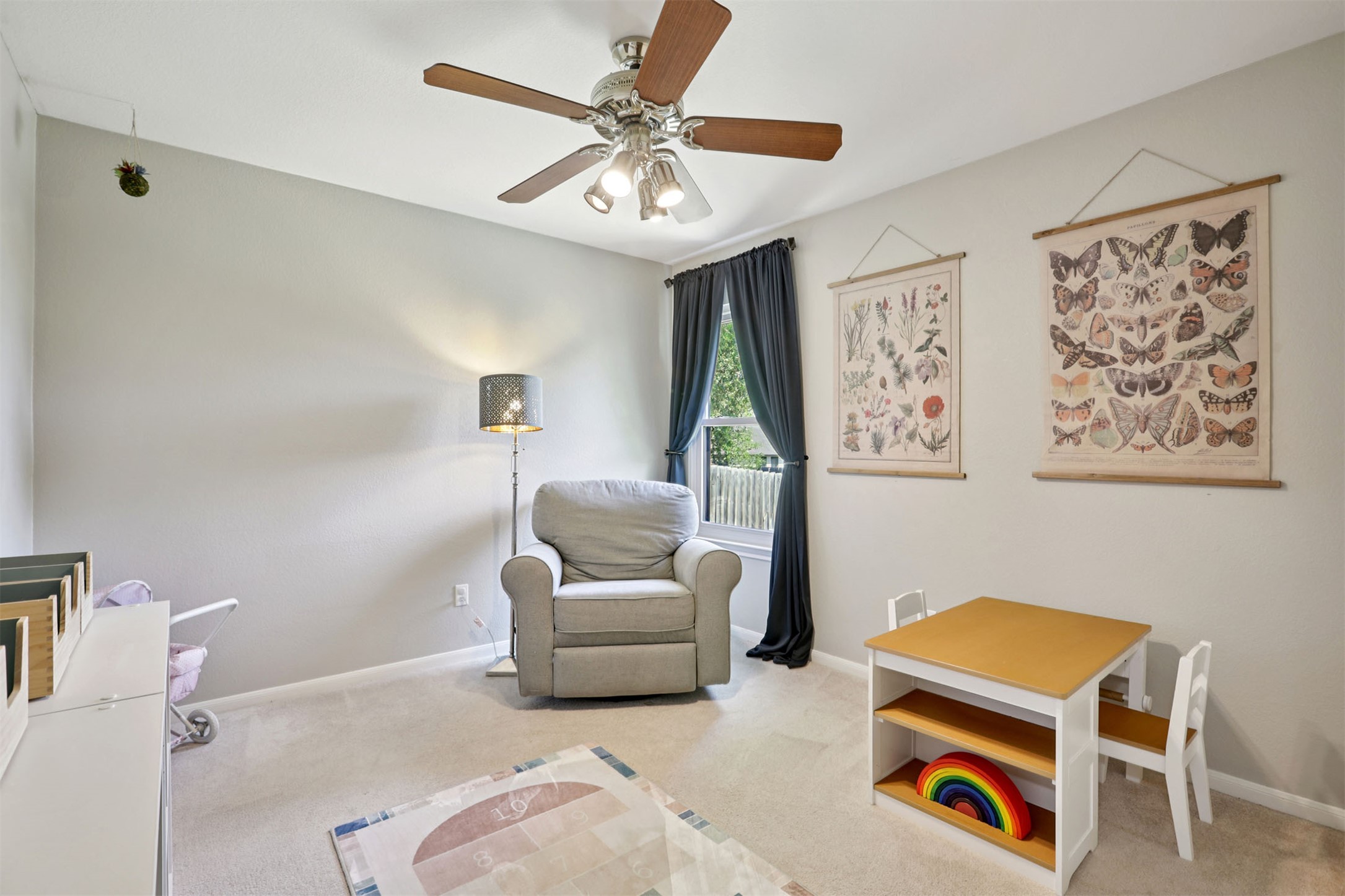 902 Ridgemont Circle Leander, TX 78641 - Photo 18 of 34 a living room with furniture and a chandelier