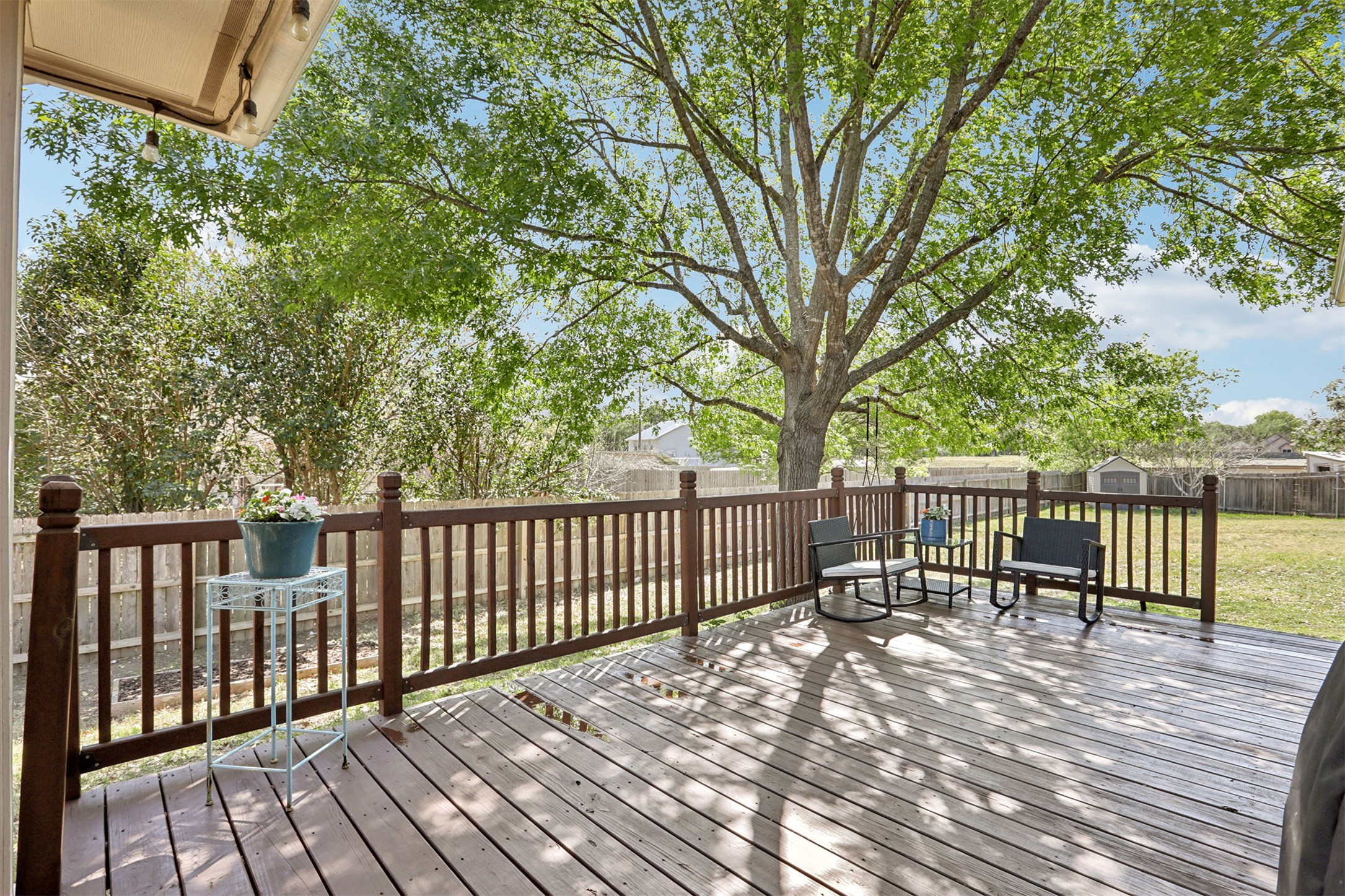 902 Ridgemont Circle Leander, TX 78641 - Photo 21 of 34 a view of balcony with wooden floor and fence