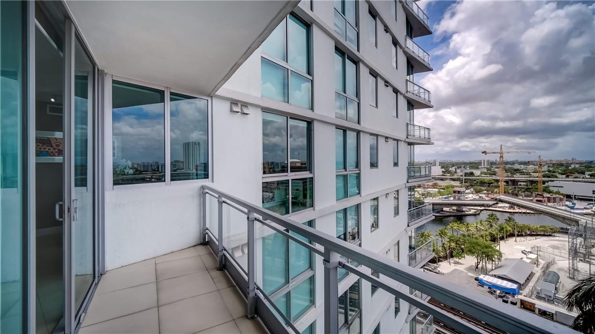 92 Southwest 3rd Street, Unit 1606 Miami, FL 33130 - Photo 21 of 62 a view of balcony with a potted plant and stairs