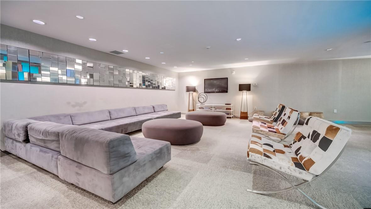 92 Southwest 3rd Street, Unit 1606 Miami, FL 33130 - Photo 39 of 62 a living room with furniture and a large mirror