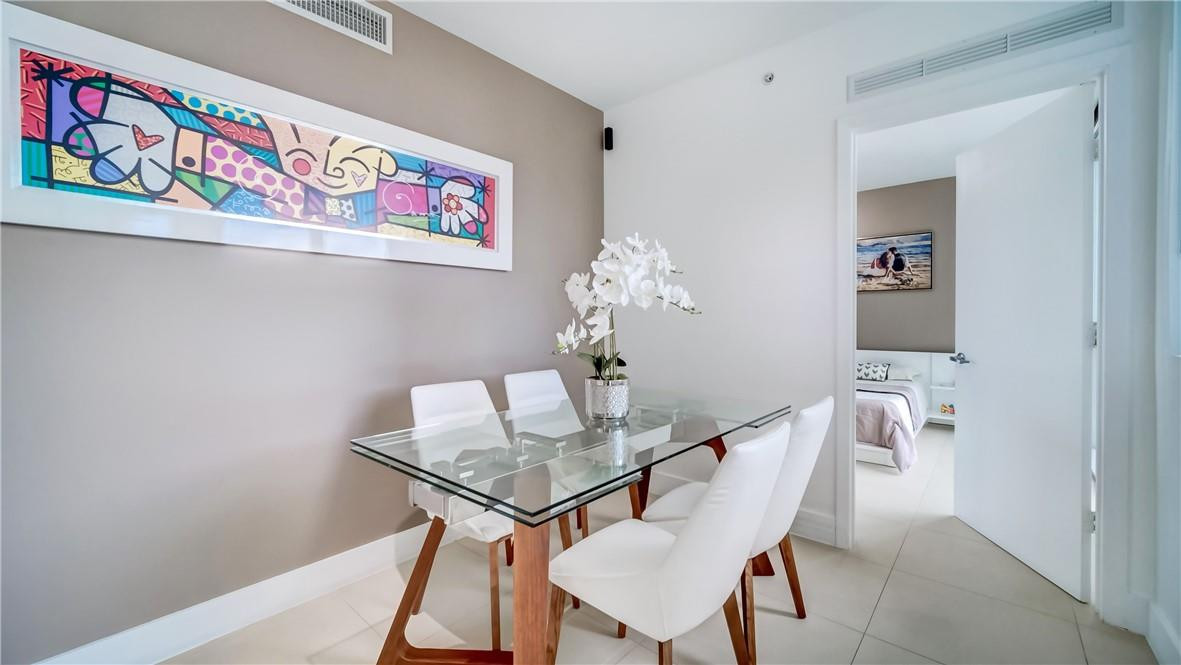 92 Southwest 3rd Street, Unit 1606 Miami, FL 33130 - Photo 6 of 62 a view of a dining room with furniture