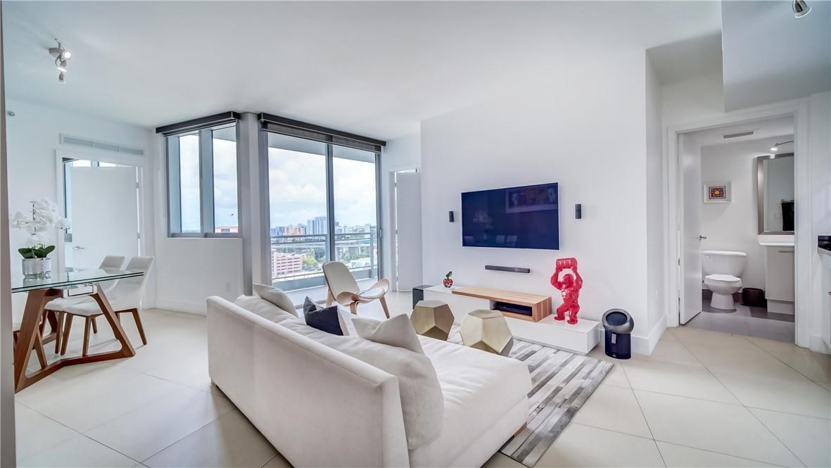 92 Southwest 3rd Street, Unit 1606 Miami, FL 33130 - Photo 7 of 62 a living room with furniture and large windows