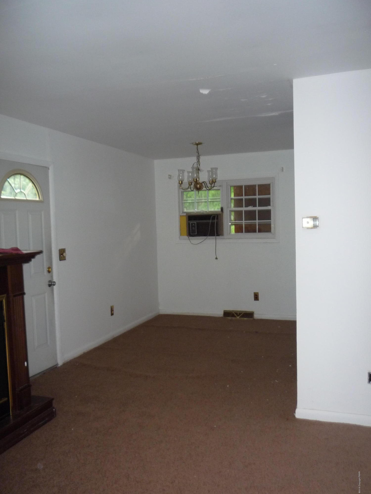 6281 Laurel Road Pocono Summit, PA 18346 - Photo 3 of 10 a view of a room with window