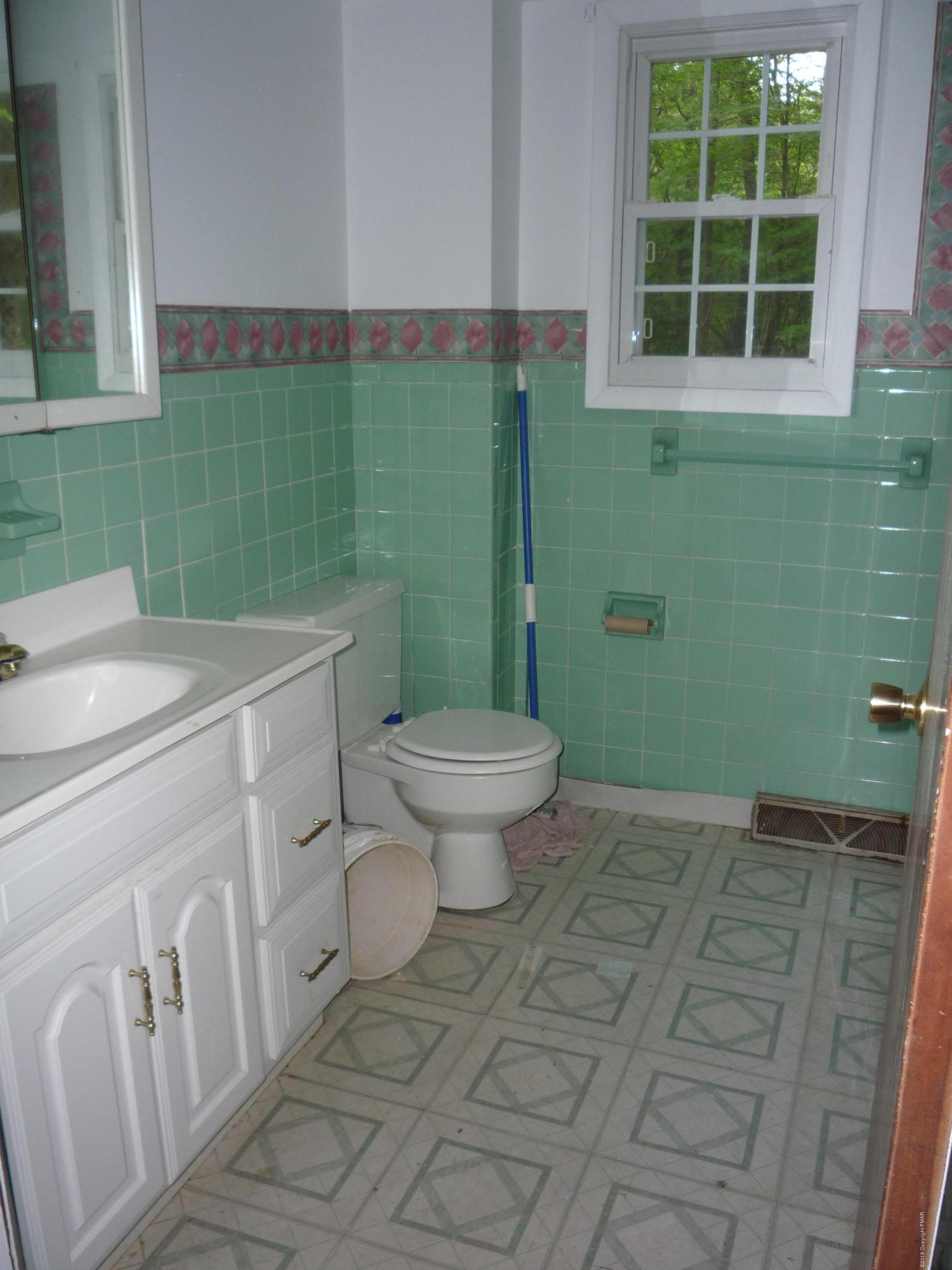 6281 Laurel Road Pocono Summit, PA 18346 - Photo 8 of 10 a bathroom with a sink toilet and a window