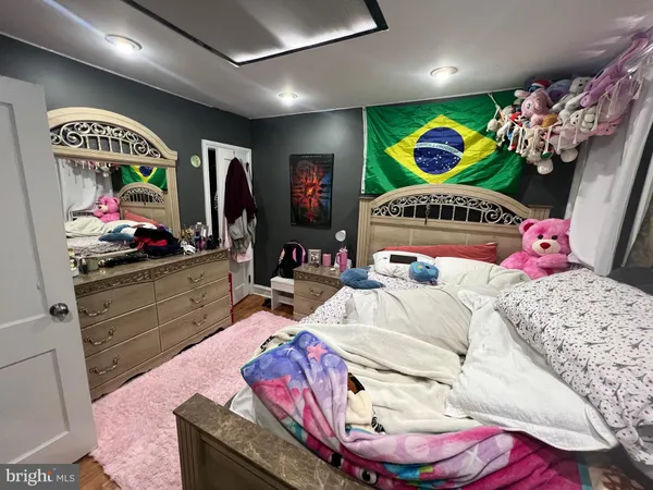 a bedroom with a bed and dresser