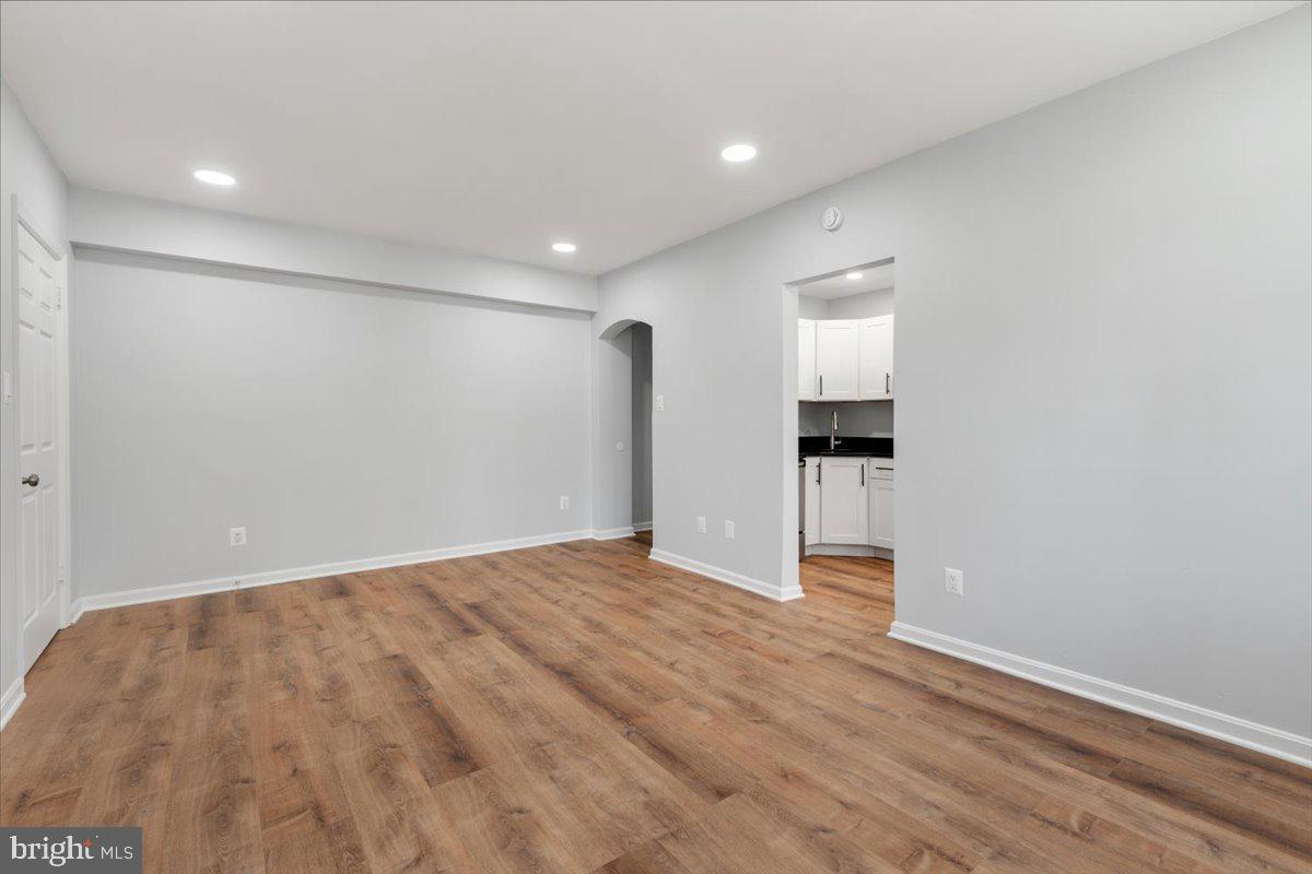 1909 North Rhodes Street, Unit 25 Arlington, VA 22201 - Photo 21 of 30 a view of empty room with wooden floor