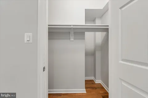 a kitchen with cabinets and white appliances