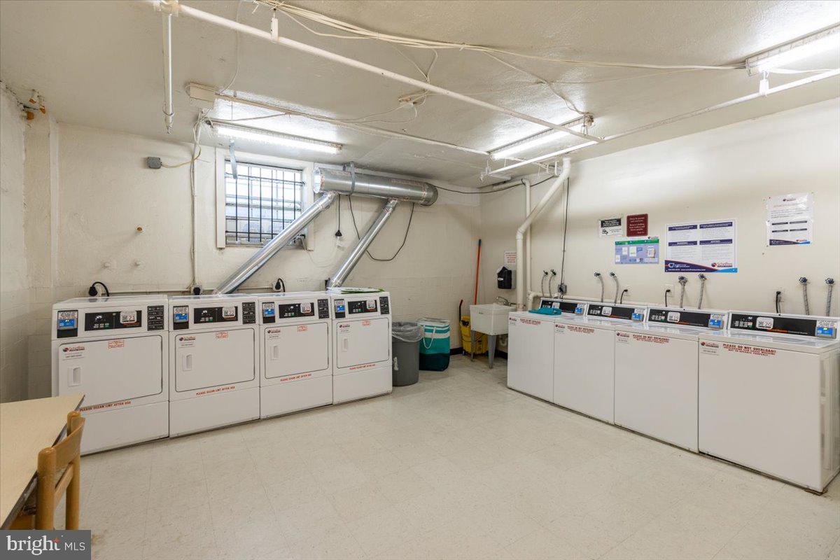 1909 North Rhodes Street, Unit 25 Arlington, VA 22201 - Photo 28 of 30 a kitchen with cabinets and white appliances