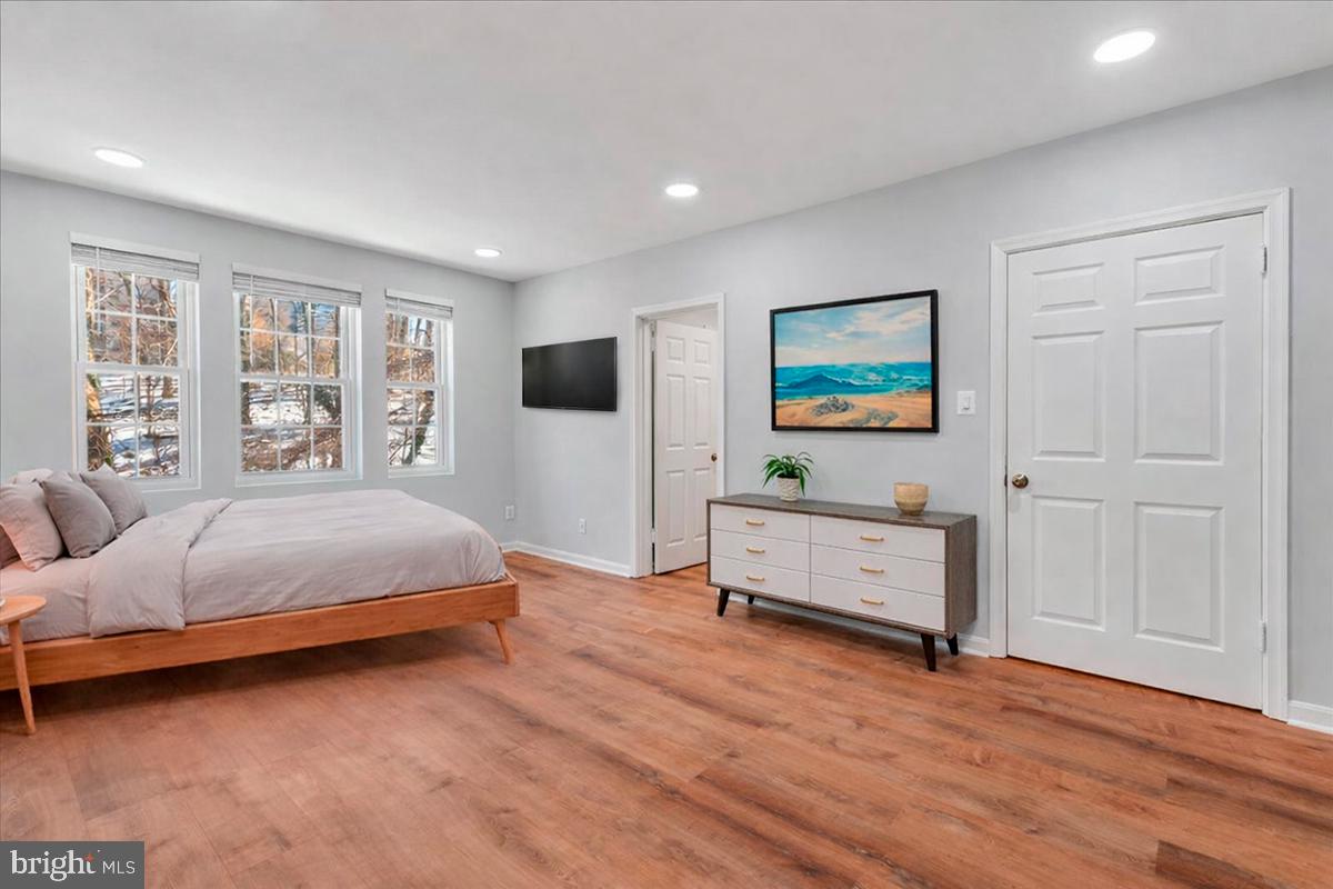 1909 North Rhodes Street, Unit 25 Arlington, VA 22201 - Photo 8 of 30 a spacious bedroom with a bed and a window