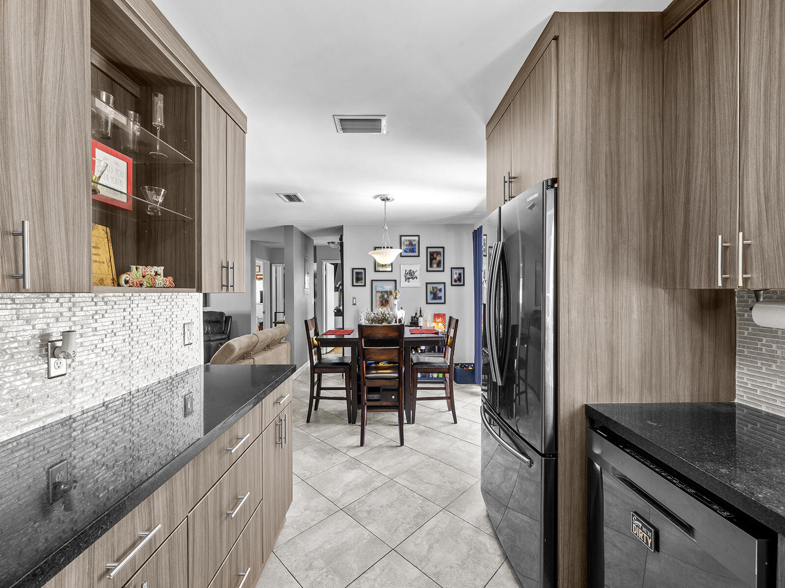 6960 Thomas Street Hollywood, FL 33021 - Photo 13 of 32 a kitchen with stainless steel appliances granite countertop a refrigerator and a sink