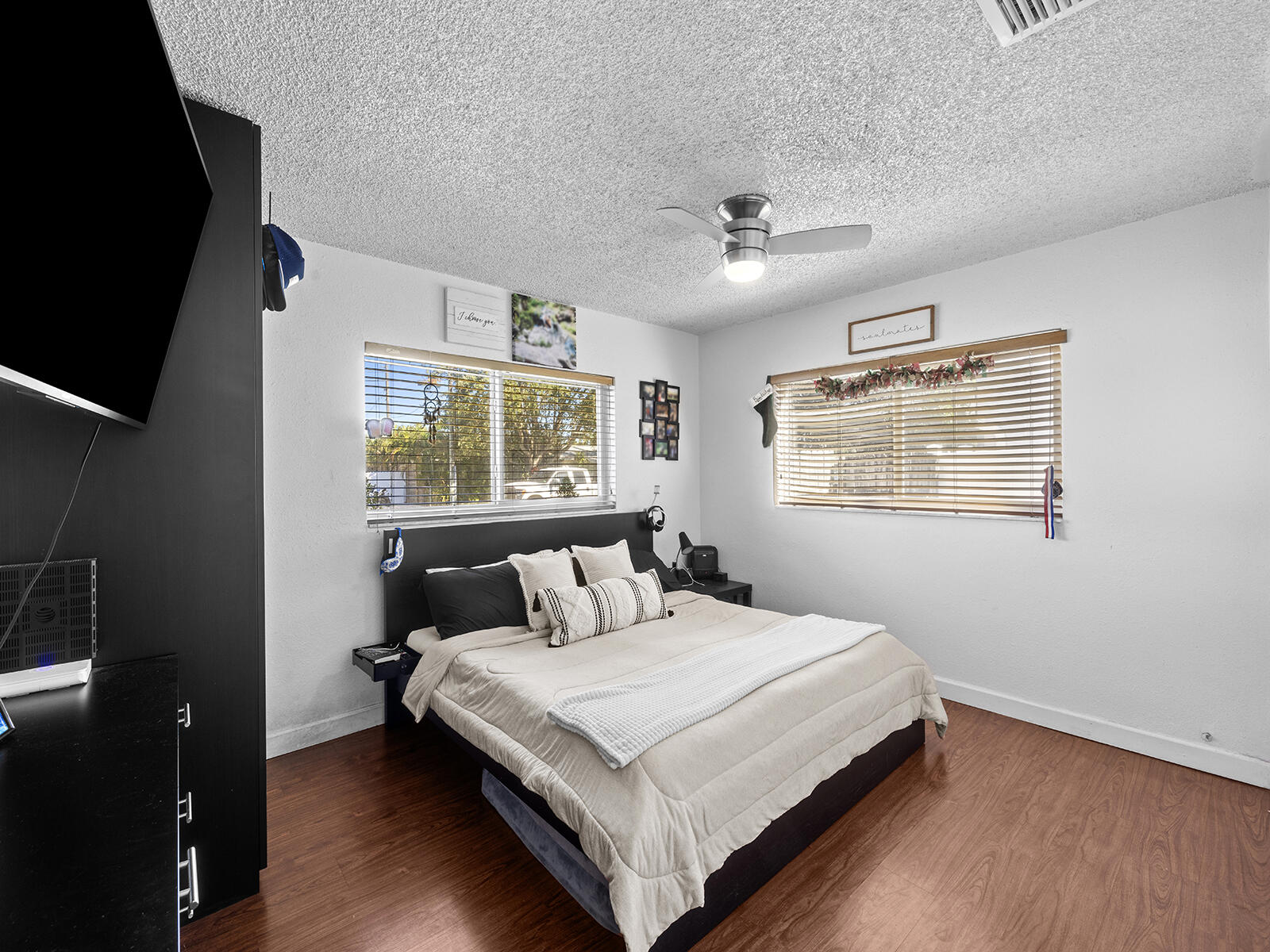 6960 Thomas Street Hollywood, FL 33021 - Photo 15 of 32 a bedroom with a bed and a window