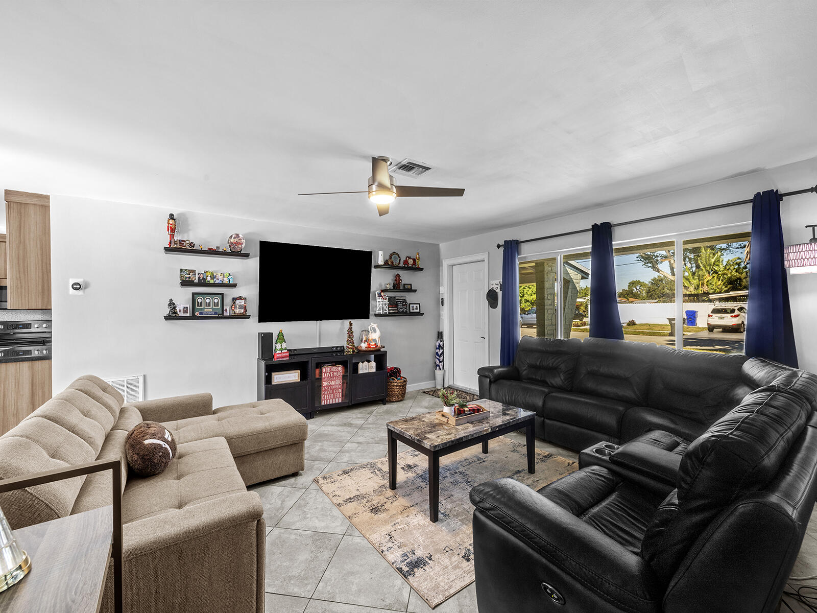 6960 Thomas Street Hollywood, FL 33021 - Photo 7 of 32 a living room with furniture and a flat screen tv