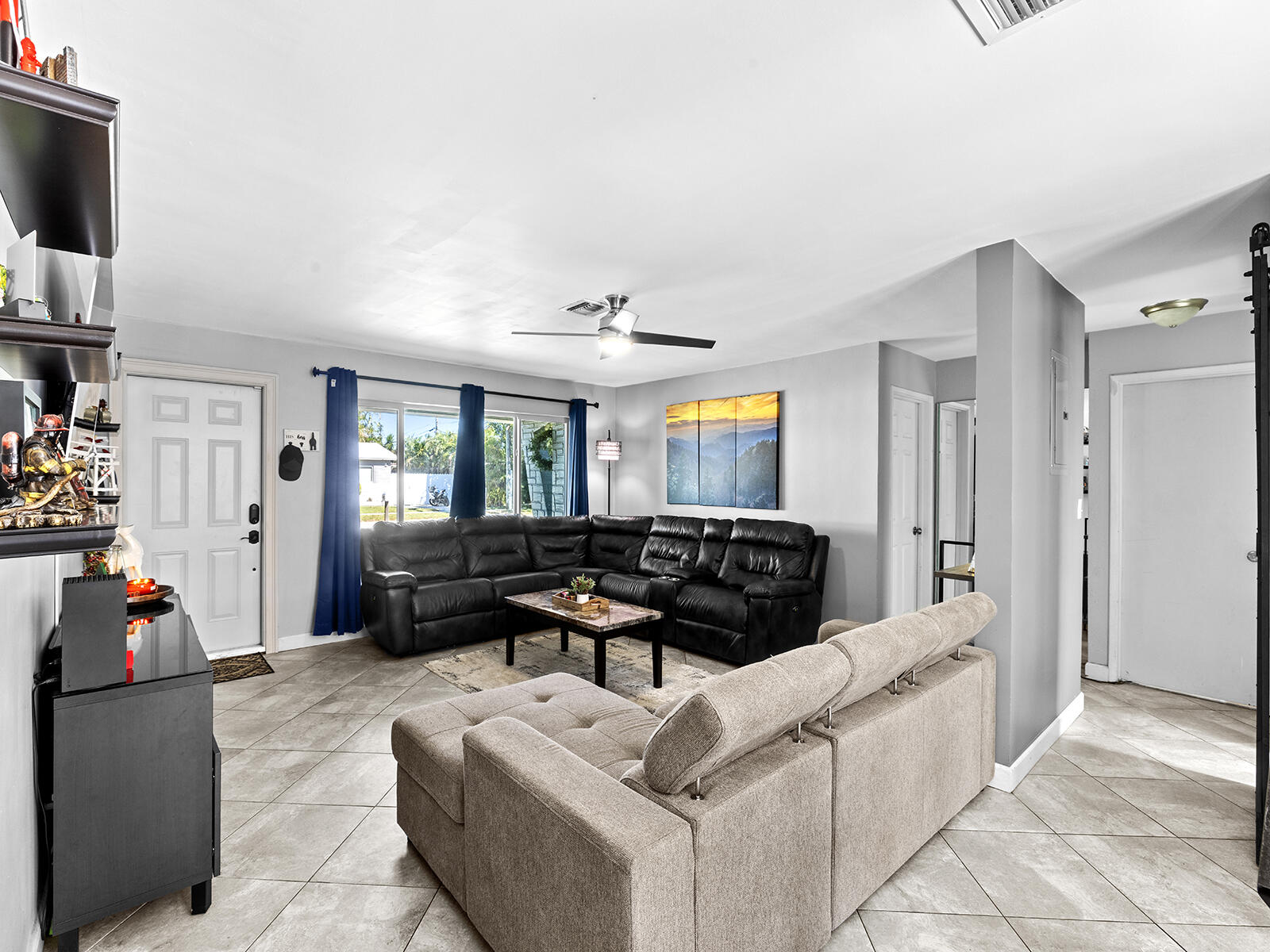 6960 Thomas Street Hollywood, FL 33021 - Photo 9 of 32 a living room with furniture and a flat screen tv