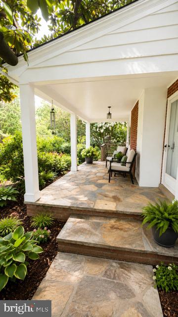 241 Edwards Ferry Road Northeast Leesburg, VA 20176 - Photo 36 of 41 Charming porch with lush greenery.