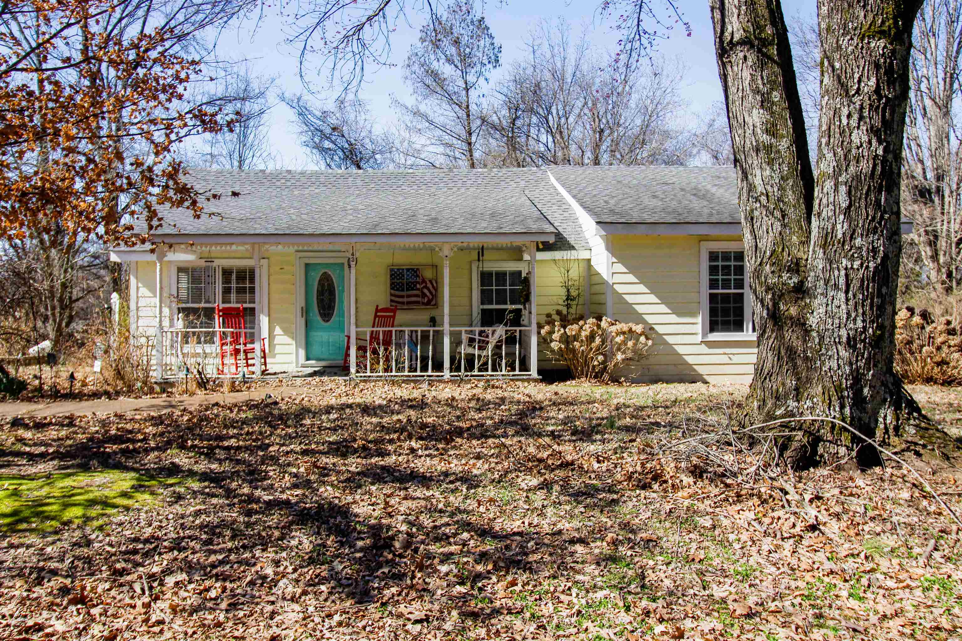 Ranch-style home featuring a porch