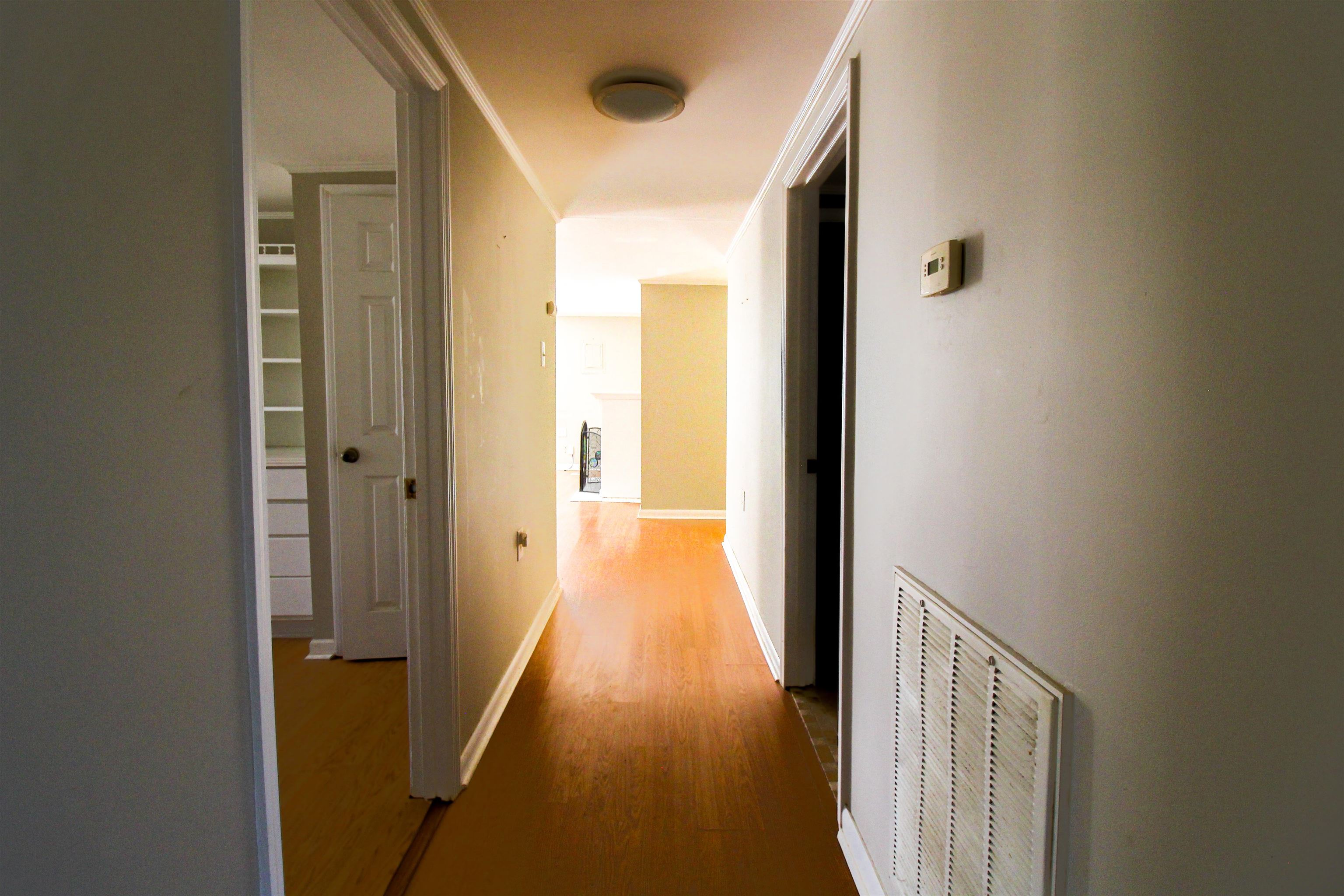 143 Marys Chapel Road Ripley, TN 38063 - Photo 16 of 23 Hallway featuring light wood-style floors and baseboards