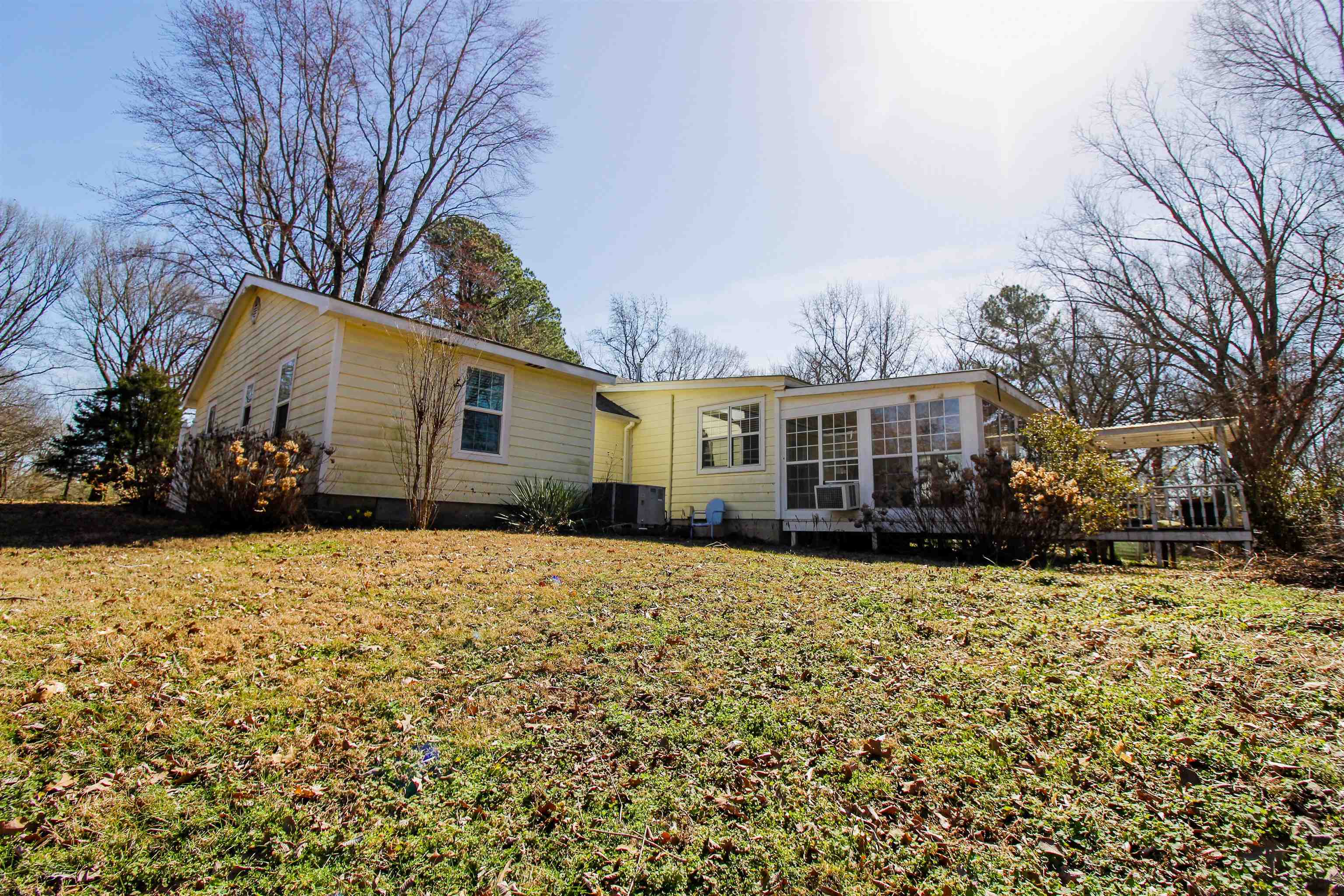 143 Marys Chapel Road Ripley, TN 38063 - Photo 20 of 23 Rear view of property featuring a yard