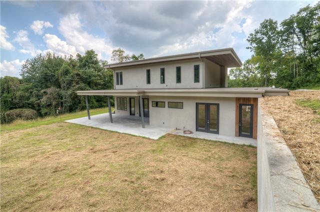 3136 Southall Road Franklin, TN 37064 - Photo 3 of 20 Back of house from left to right shows off the doors from the living room, the master bedroom and the garage. The first floor roof was designed to accommodate a future roof top deck!