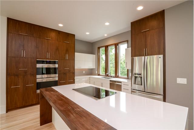 3136 Southall Road Franklin, TN 37064 - Photo 4 of 20 Custom kitchen features White Zeus Quartz Counter Tops and Kenmore Elite appliances with induction cooktop!