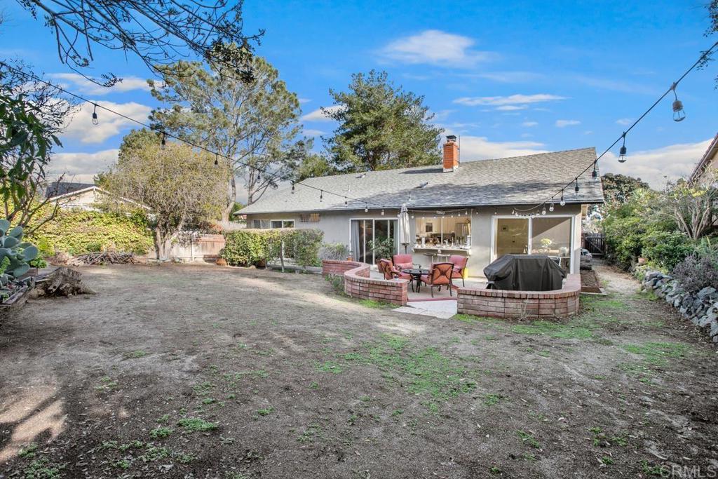 13260 Carousel Lane Del Mar, CA 92014 - Photo 3 of 10 a view of a patio with table and chairs under an umbrella