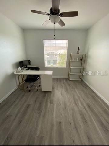 8836 Indigo Trail Loop Riverview, FL 33578 - Photo 5 of 11 a workspace with wooden floor and a window