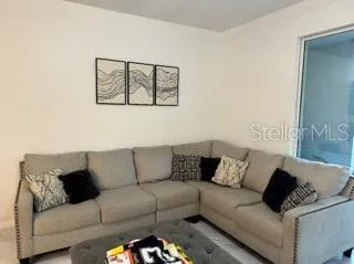 a living room with furniture and a couch