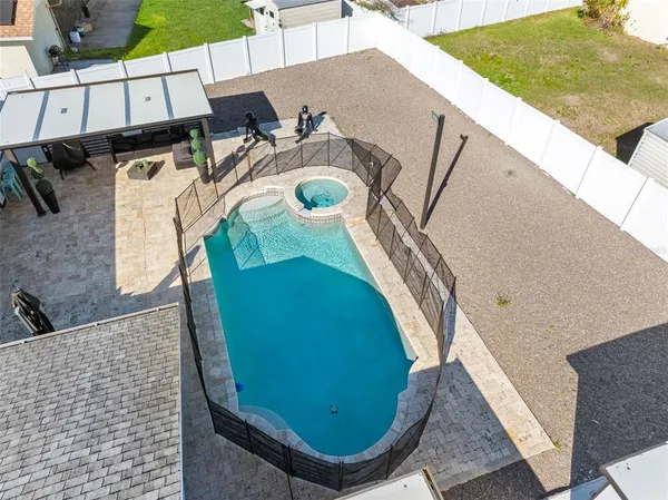 an aerial view of a house with swimming pool