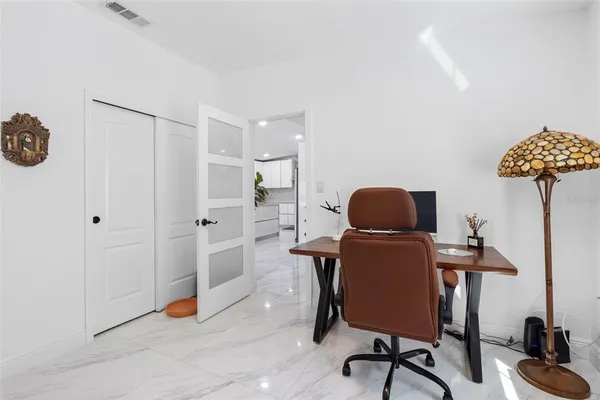 a bathroom with a shower and a sink