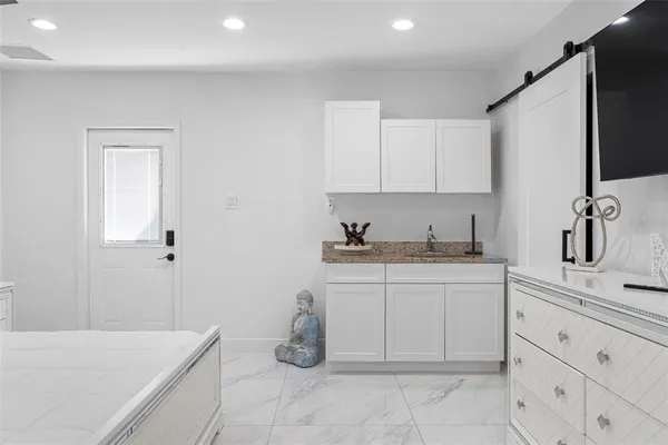 a bathroom with a shower and a sink