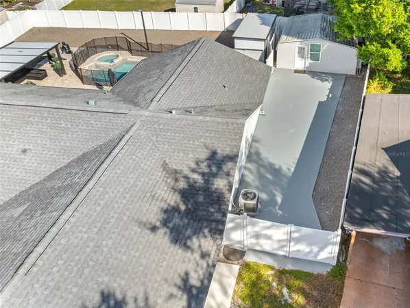 an aerial view of residential building with parking space