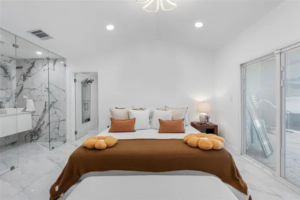 a living room with furniture and white walls