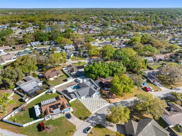 an aerial view of residential houses with outdoor space