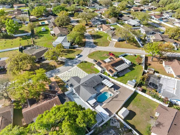 an aerial view of residential houses with outdoor space