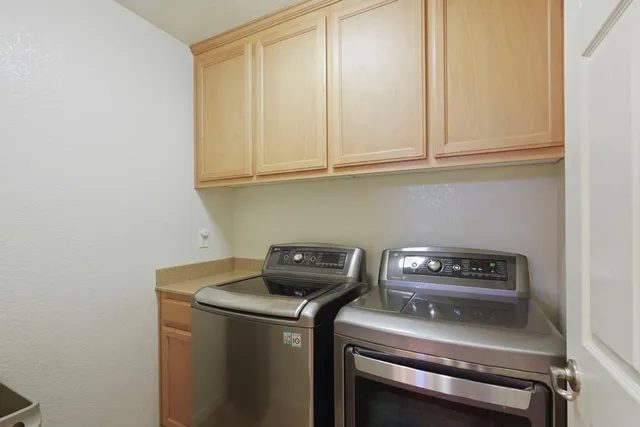a view of a room that has a table and chairs
