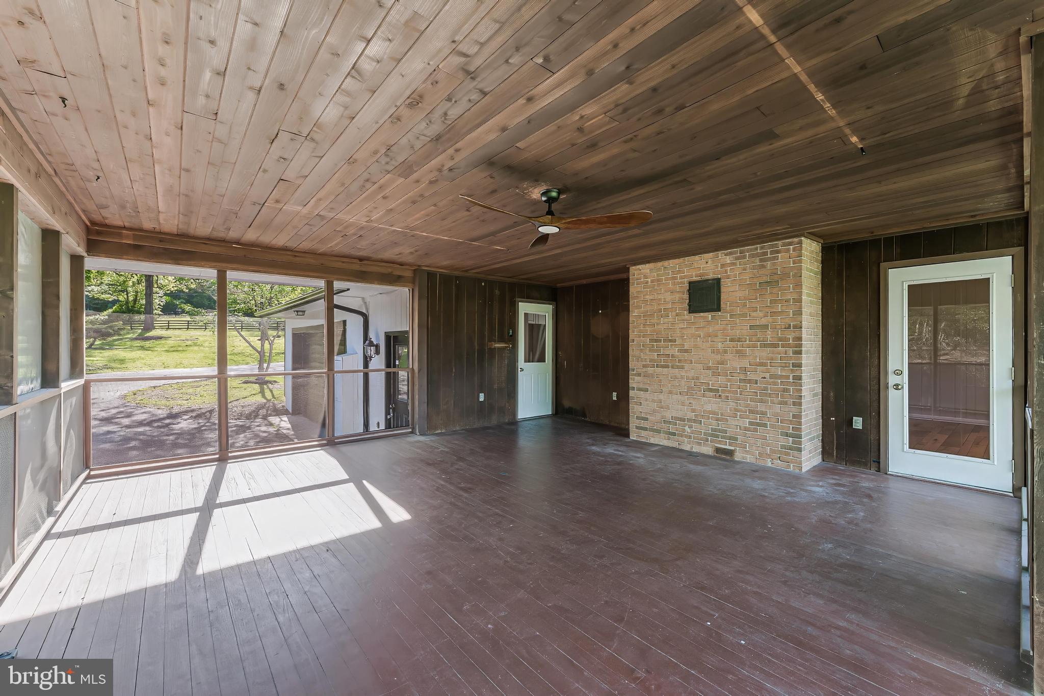 6891 Wilson Road Marshall, VA 20115 - Photo 99 of 118 Spacious screened porch with natural light.